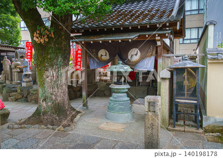 Osaka, Japan - Sep 21 2024, close-up view of the altar with a lantern or an incense candlestick, on the territory of the Shitenno-ji buddhist temple, at daytime, without people, Osaka, Japan 140198178