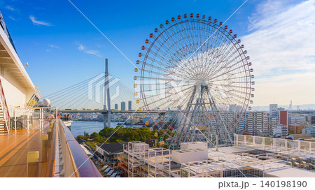 Osaka, Japan - Oct 11 2024, Panoramic aerial view of the Tempozan Ferris Wheel at the Osaka Port Cruise Terminal and the facade of the MSC Bellissima cruise ship, at daytime, Osaka, Japan Osaka, Japan - Oct 11 2024, Panoramic aerial view of the Tempozan Ferris Wheel at the Osaka Port Cruise Terminal and the facade of the MSC Bellissima cruise ship, at daytime, Osaka, Japan 140198190