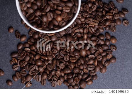 Roasted coffee beans on granite background Roasted coffee beans on granite background 140199686