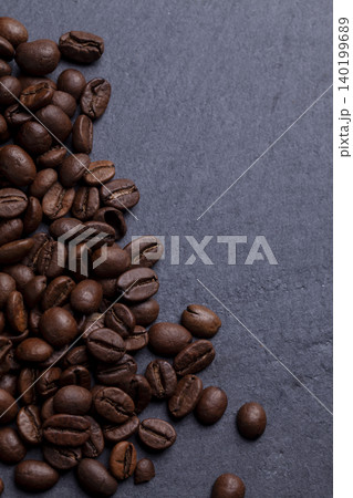 Roasted coffee beans on granite background Roasted coffee beans on granite background 140199689