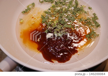 Sauce and Garnish in Cooking Pan Sauce and Garnish in Cooking Pan 140200064