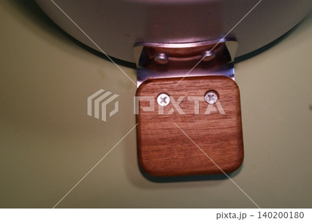 Wooden and Metal Hardware Component Close-up Wooden and Metal Hardware Component Close-up 140200180