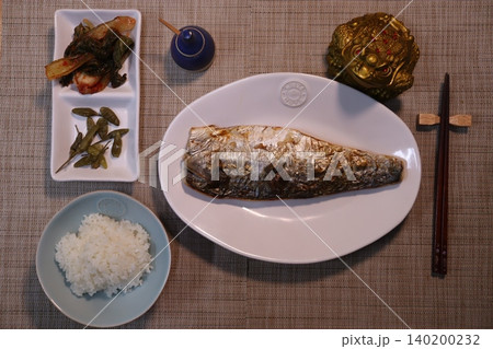 Traditional Asian Meal with Grilled Fish and Sides 140200232