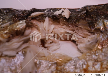 Close-up of Flaky Cooked Fish with Crispy Skin Close-up of Flaky Cooked Fish with Crispy Skin 140200241