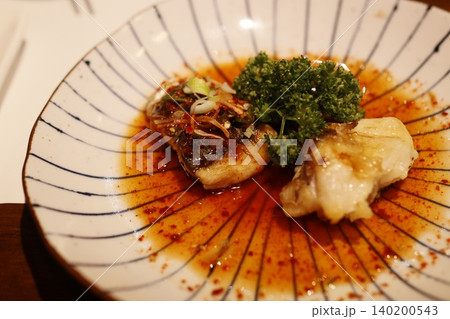 Soy-Glazed Fish with Garnish on Patterned Plate Soy-Glazed Fish with Garnish on Patterned Plate 140200543