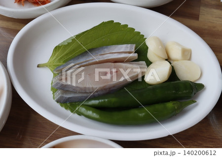 Fresh Korean Seafood Ingredients on White Plate Fresh Korean Seafood Ingredients on White Plate 140200612
