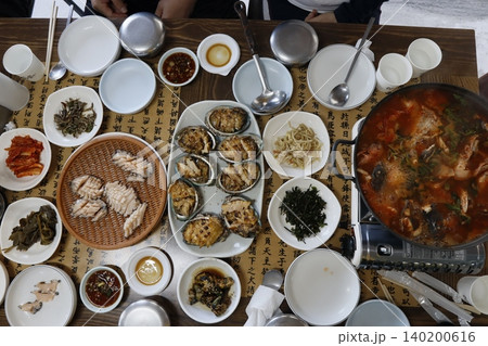 Korean Feast Table with Seafood and Hot Pot Dishes Korean Feast Table with Seafood and Hot Pot Dishes 140200616
