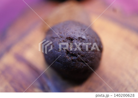 Close-up of Dark Chocolate Cookie on Wooden Surface Close-up of Dark Chocolate Cookie on Wooden Surface 140200628