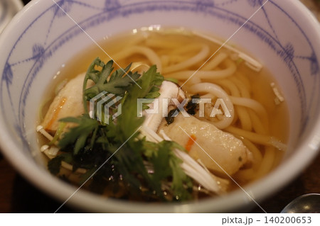 Steaming Udon Soup with Fresh Garnishes Steaming Udon Soup with Fresh Garnishes 140200653