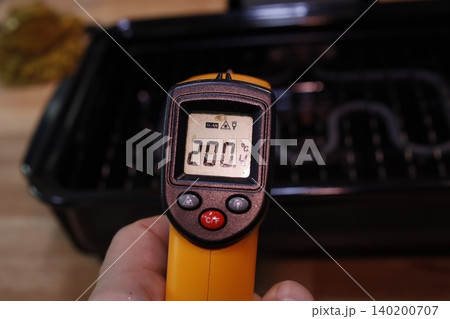 Thermometer Reading 200.4??C Near Grill 140200707