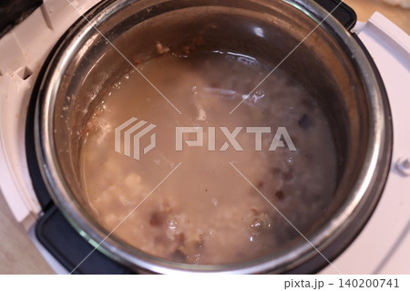Slow Cooker with Porridge or Soup Inside 140200741