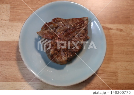 Grilled Steak on Blue Plate 140200770