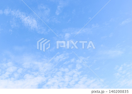 beautiful blue sky and white fluffy group of clouds with sunrise in the morning, natural background 140200835