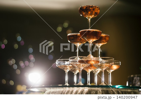 small tower of champagne's glass in wedding reception party 140200947