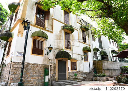 Traditional colonial architecture apartment building facade at historic heritage Lilau Square built in 1900s in Macau Traditional colonial architecture apartment building facade at historic heritage Lilau Square built in 1900s in Macau 140202570