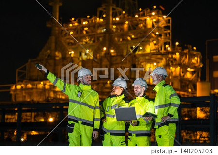 Group of Petroleum Professional Engineer Team Working against Oil Gas Refinery Offshore Construction Group of Petroleum Professional Engineer Team Working against Oil Gas Refinery Offshore Construction 140205203