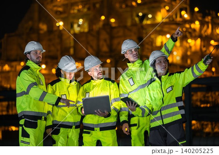 Group of Petroleum Professional Engineer Team Working against Oil Gas Refinery Offshore Construction 140205225