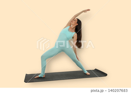 Yoga session features a woman stretching on a mat Yoga session features a woman stretching on a mat 140207683