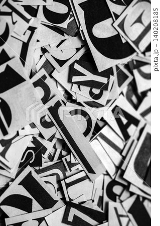 Pile of many black and white letters from newspapers and magazines. Typography background composition. Pile of many black and white letters from newspapers and magazines. Typography background composition. 140208185