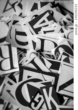Pile of many black and white letters from newspapers and magazines. Typography background composition. Pile of many black and white letters from newspapers and magazines. Typography background composition. 140208191