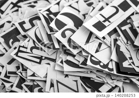 Pile of many black and white letters from newspapers and magazines. Typography background composition. 140208253