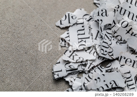 Scraps of paper with words and letters from magazines and newspapers Scraps of paper with words and letters from magazines and newspapers 140208289