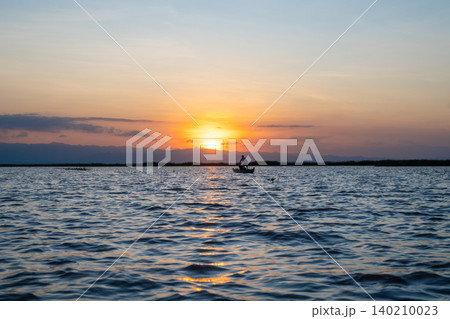 Boat at sunset on Lake Tempe, Sulawesi, Indonesia Boat at sunset on Lake Tempe, Sulawesi, Indonesia 140210023
