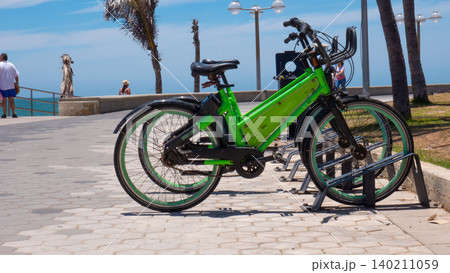 Mazatlan, Mexico - May 14, 2019: Electric vehicle. Rental bicycle of Vbike parked in the street. Electric bike or bicycle. Electric bicycle for rent. Vbike. Electric bike rental Vbike, copy space 140211059
