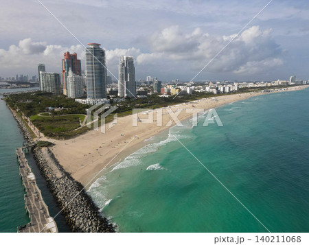 Cityscape landscape of South Beach. Florida panorama. Skyscraper architecture of Miami. Miami South beach landscape aerial view. Aerial Miami skyscraper. Aerial Miami south beach. Cloudy weather Cityscape landscape of South Beach. Florida panorama. Skyscraper architecture of Miami. Miami South beach landscape aerial view. Aerial Miami skyscraper. Aerial Miami south beach. Cloudy weather 140211068