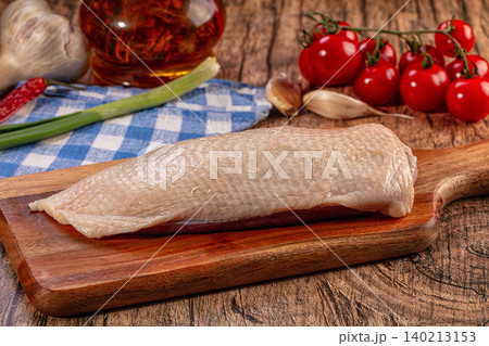Raw Duck Breast on Wooden Board with Fresh Ingredients Raw Duck Breast on Wooden Board with Fresh Ingredients 140213153