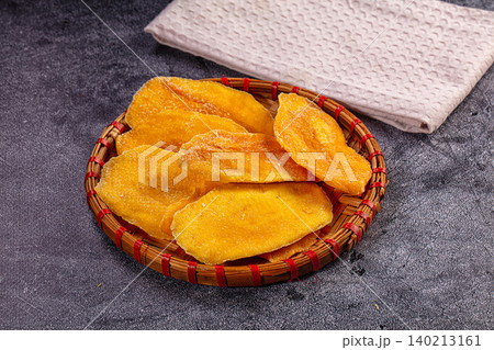 Sweet Dried Mango Slices in Traditional Woven Basket Sweet Dried Mango Slices in Traditional Woven Basket 140213161