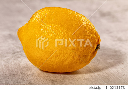Vibrant yellow lemon, fresh citrus fruit, textured background 140213178