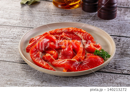 Sliced salted salmon fish fillet on plate Sliced salted salmon fish fillet on plate 140213272