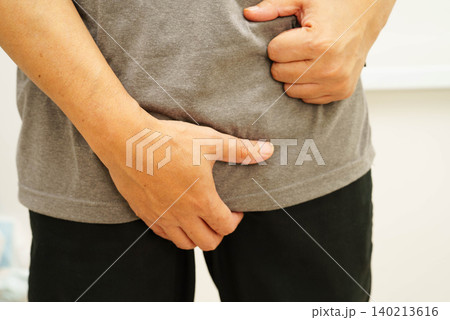 Hernia, Asian man stomach ache, abdominal pain and urology problem health. 140213616