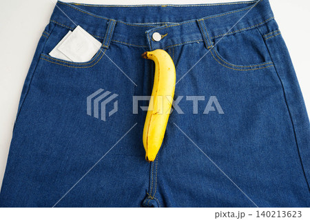 Banana with measuring tape on jean trousers, penis health. 140213623