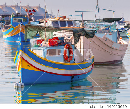 Traditional fishing boats in Marsaxlokk harbor Malta 140213659