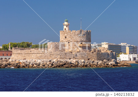 Saint Nicholas Fort with lighthouse in Rhodes harbor on sunny clear summer day 140213832