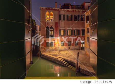 Night view of Venice canal from open window, Italy Night view of Venice canal from open window, Italy 140213929
