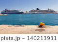 Cruise ships docked in Rhodes harbor with blue sea and pier on sunny summer day 140213931