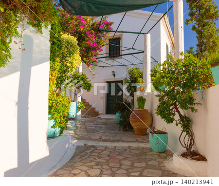 White courtyard with potted plants in Corfu, Greece White courtyard with potted plants in Corfu, Greece 140213941