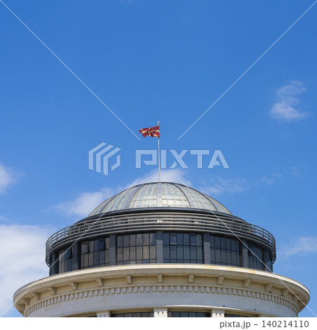 Macedonian flag flies atop a dome of a building Macedonian flag flies atop a dome of a building 140214110