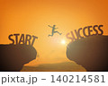 Male person jumps across a gap between start and success against gold sunset sky, sun 140214581