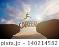 Career concept. Male person jumps across a gap against  sky with clouds 140214582