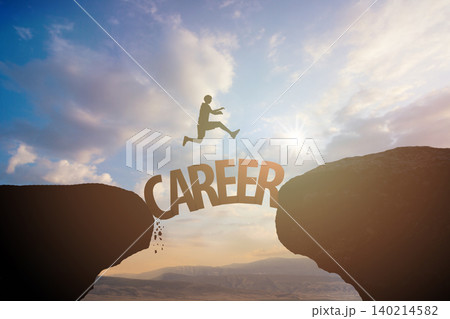 Career concept. Male person jumps across a gap against  sky with clouds 140214582