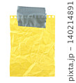 Yellow crumpled notebook paper sheet hanging, attached with strong gray duct tape, isolated on transparent background 140214891