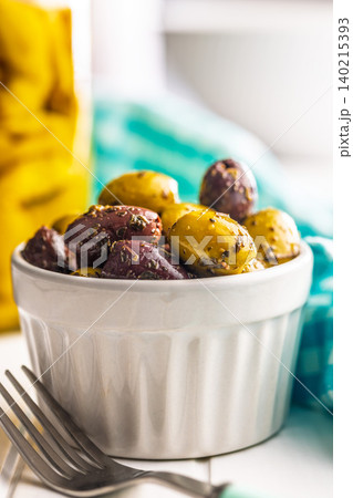 Marinated Olives in a Ceramic Bowl. Mediterranean Appetizer for Entertaining and Snacks Marinated Olives in a Ceramic Bowl. Mediterranean Appetizer for Entertaining and Snacks 140215393