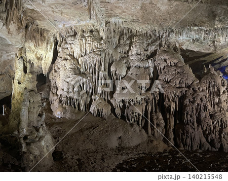 Dark cave with stalactites. Grunge karst texture background Dark cave with stalactites. Grunge karst texture background 140215548