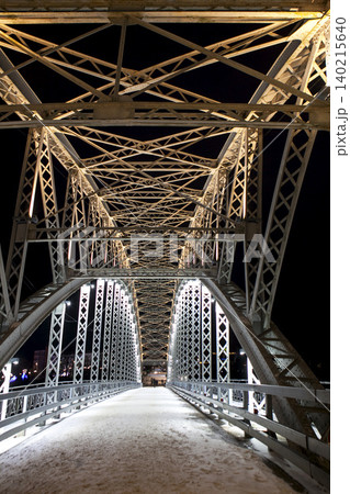 The first arch bridge built ithe Belelyubsky Bridge with nighttime illumination. Borovichi, Russia The first arch bridge built ithe Belelyubsky Bridge with nighttime illumination. Borovichi, Russia 140215640