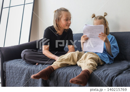 Cute little girl and boy children having fun at home 140215769