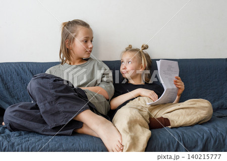 Adorable children reading and learning at home Adorable children reading and learning at home 140215777
